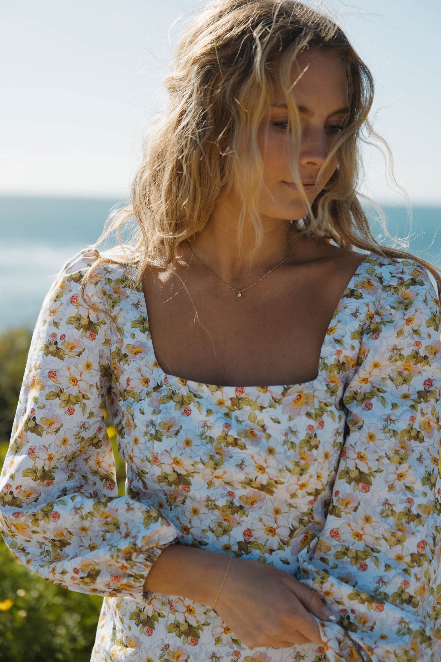 Woman in pink floral dress