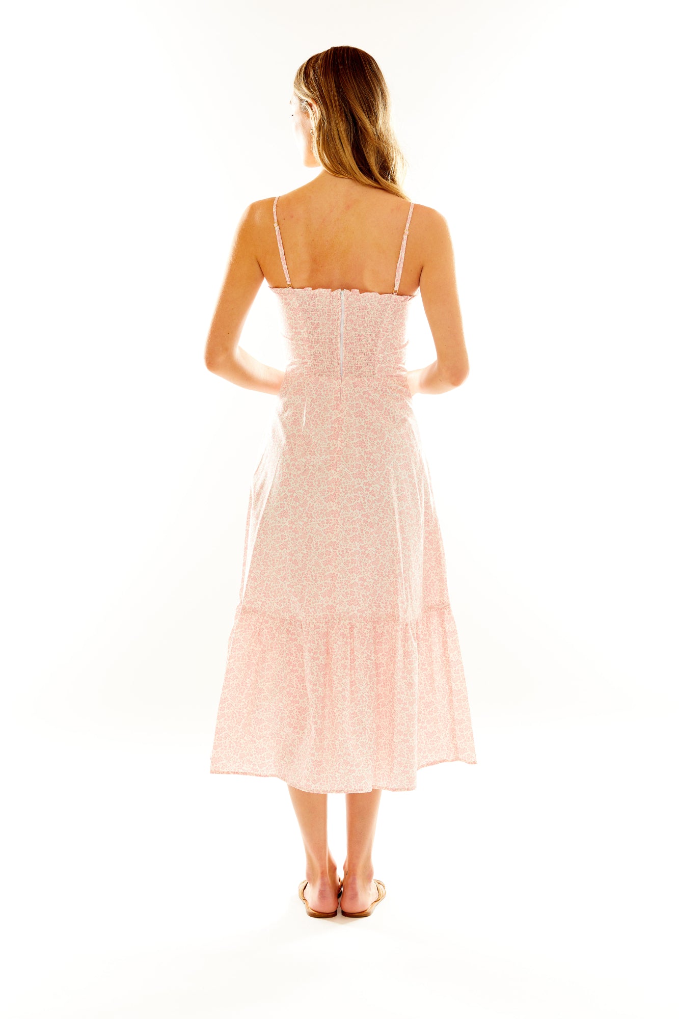 Woman in pink floral dress