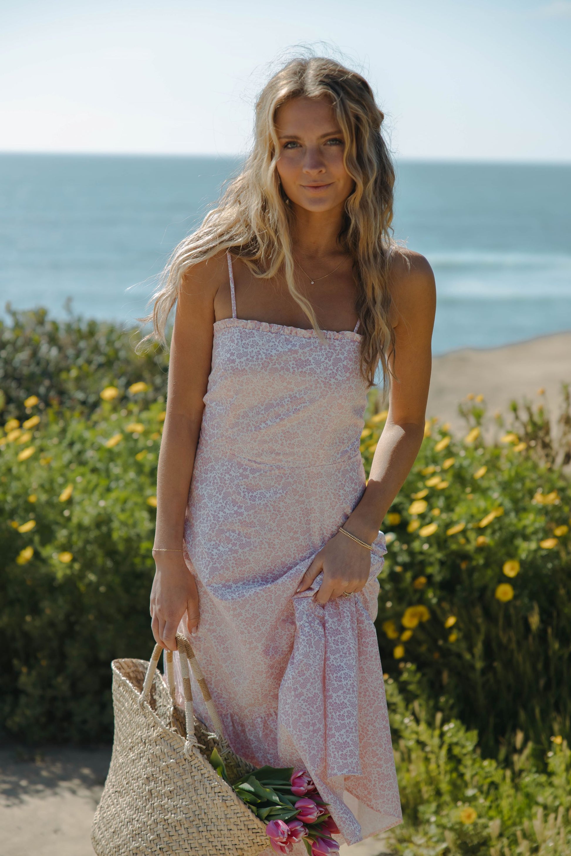 Woman in pink floral dress