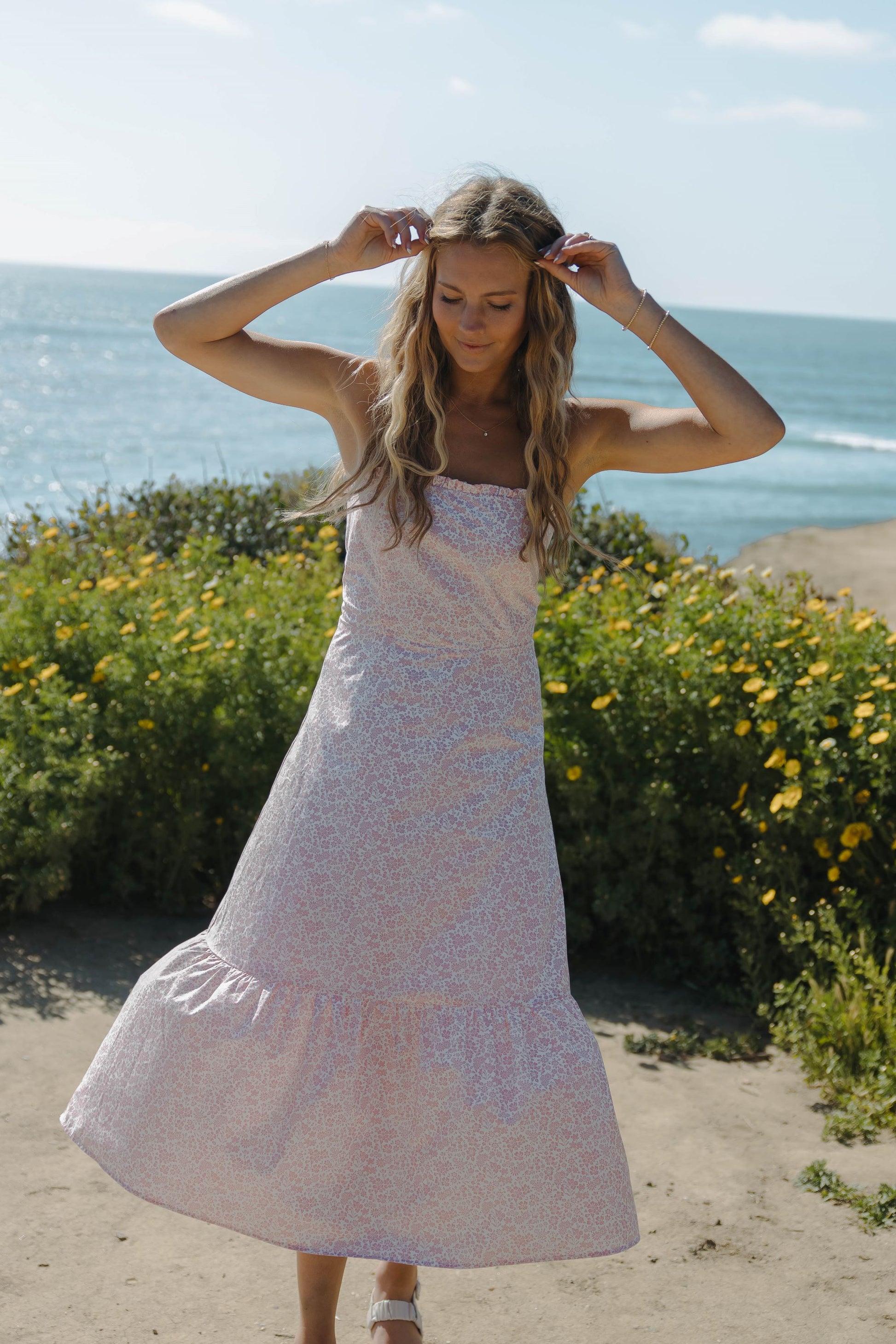 Woman in pink floral dress