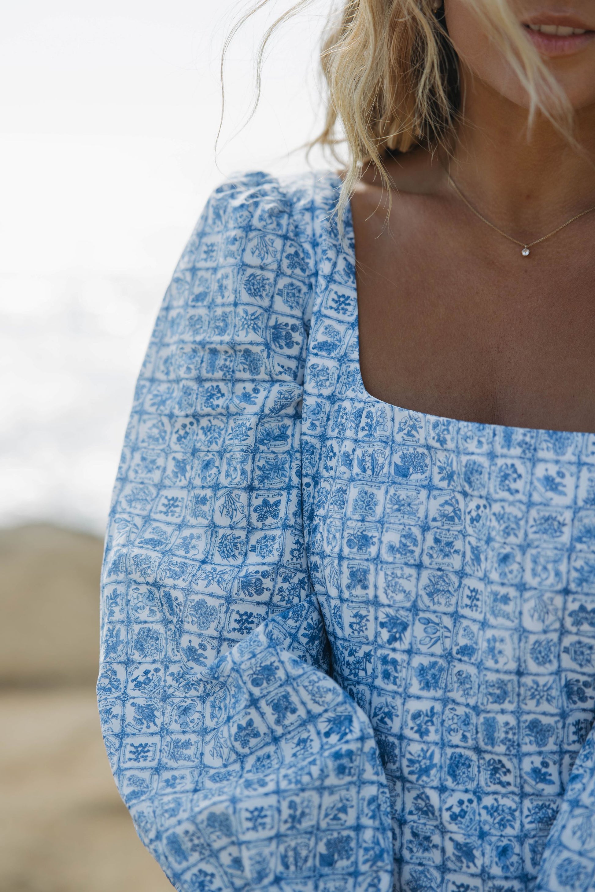 Woman in blue floral dress