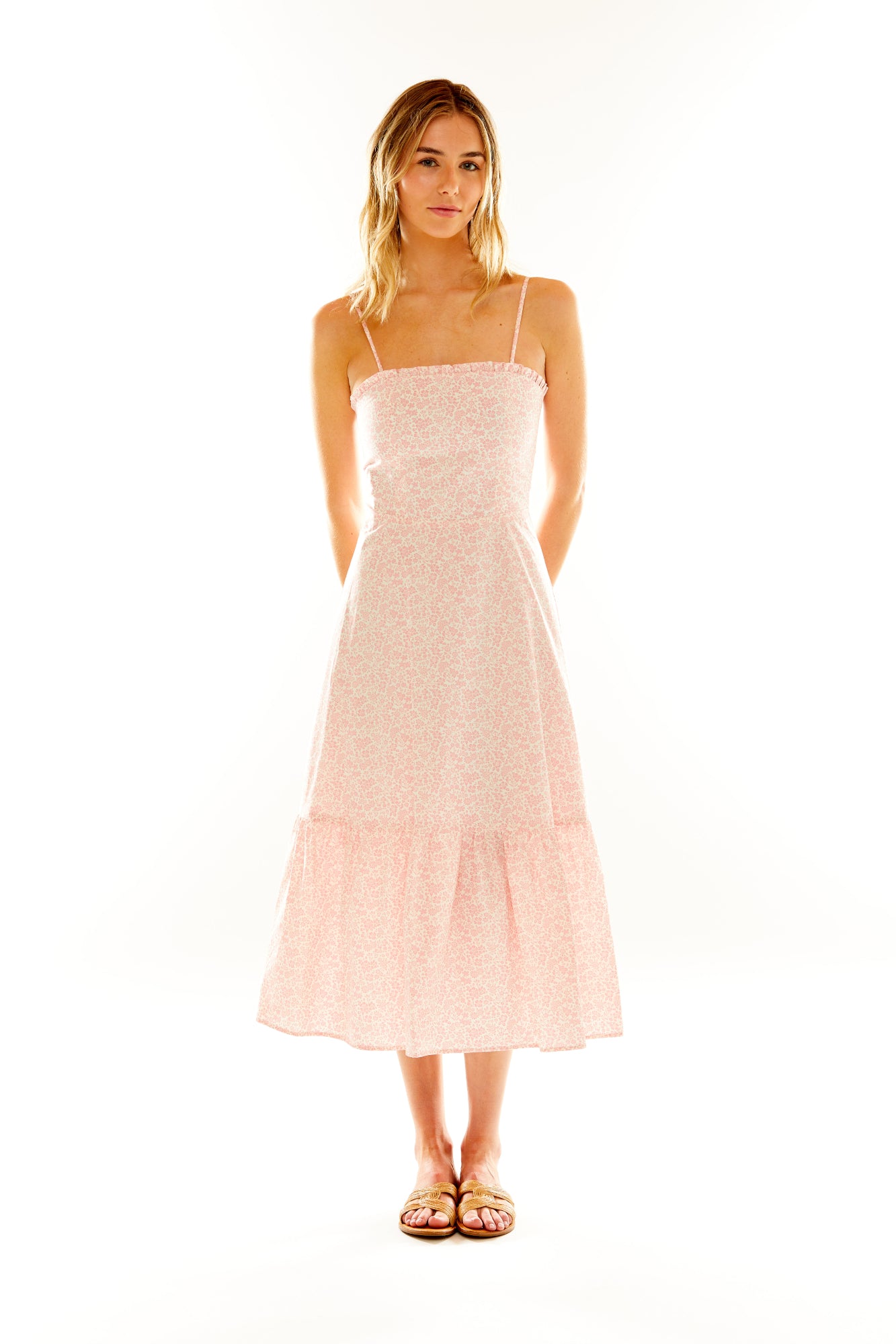 Woman in pink floral dress