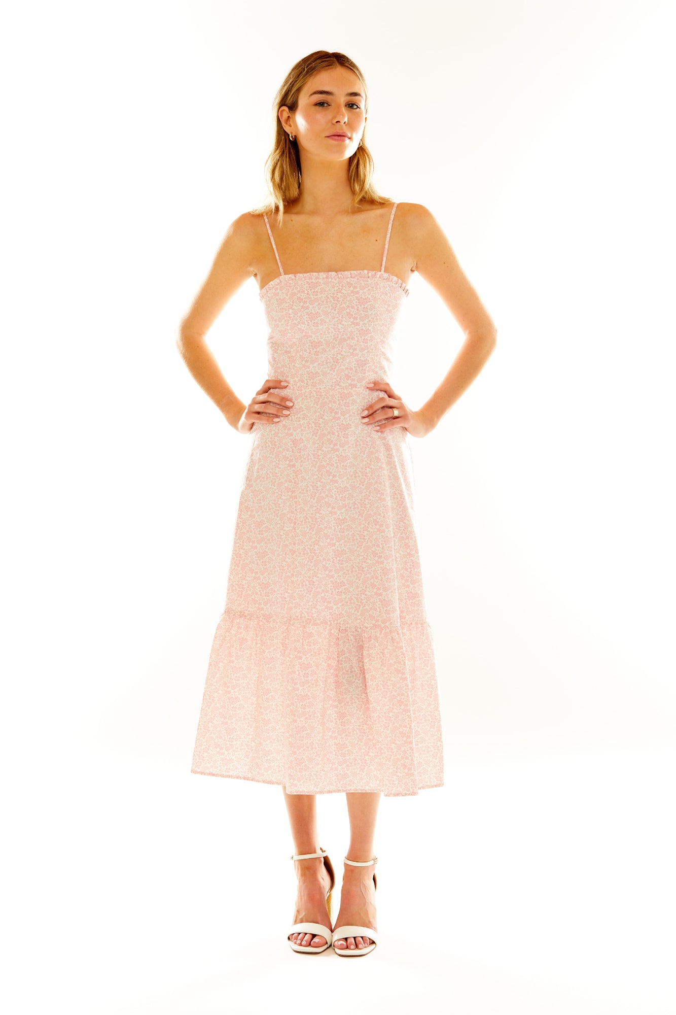 Woman in pink floral dress