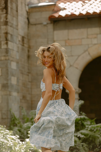 Woman in blue toile dress