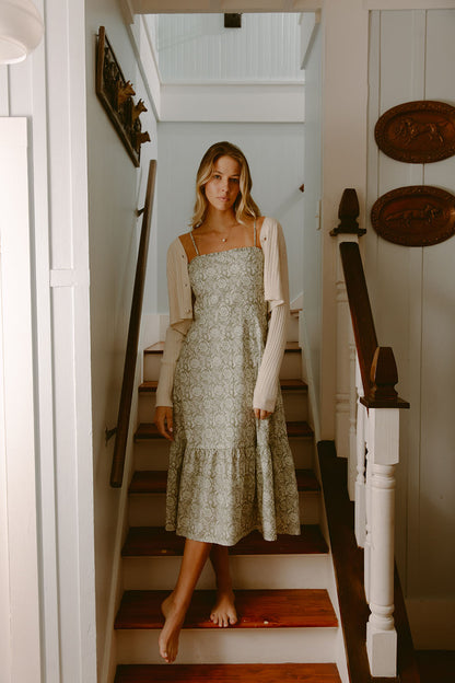 Woman in green printed dress