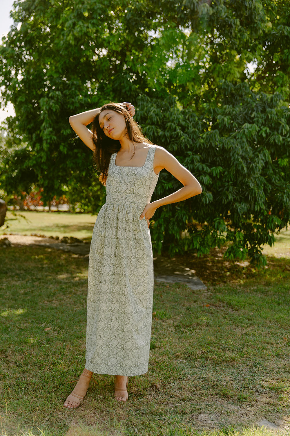 Woman in green floral dress