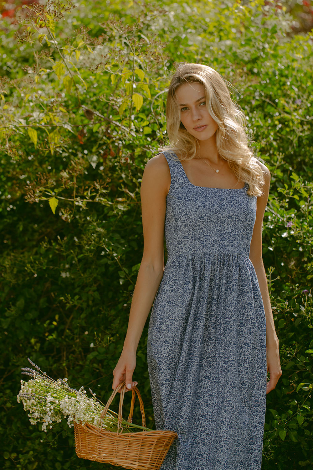 Woman in blue floral dress