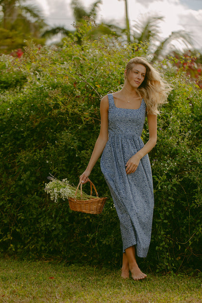 Woman in blue floral dress