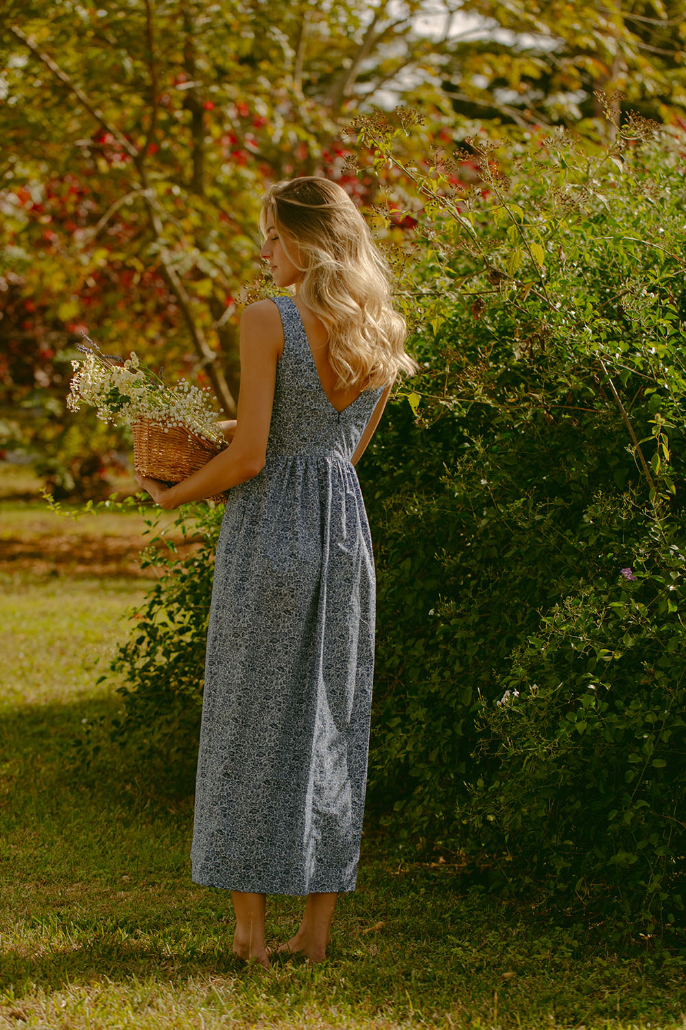 Woman in blue floral dress