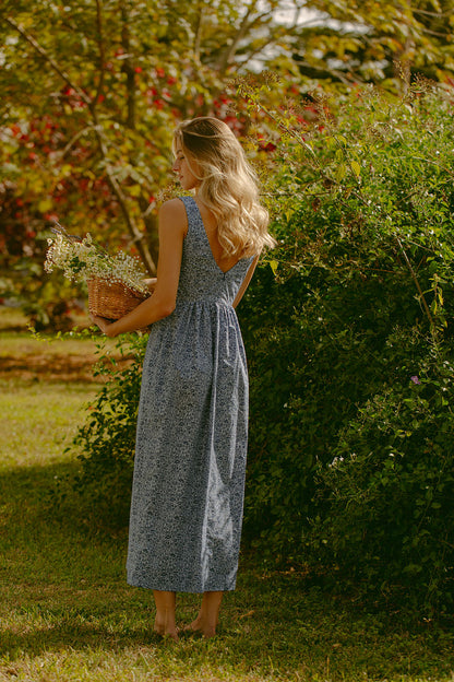 Woman in blue floral dress