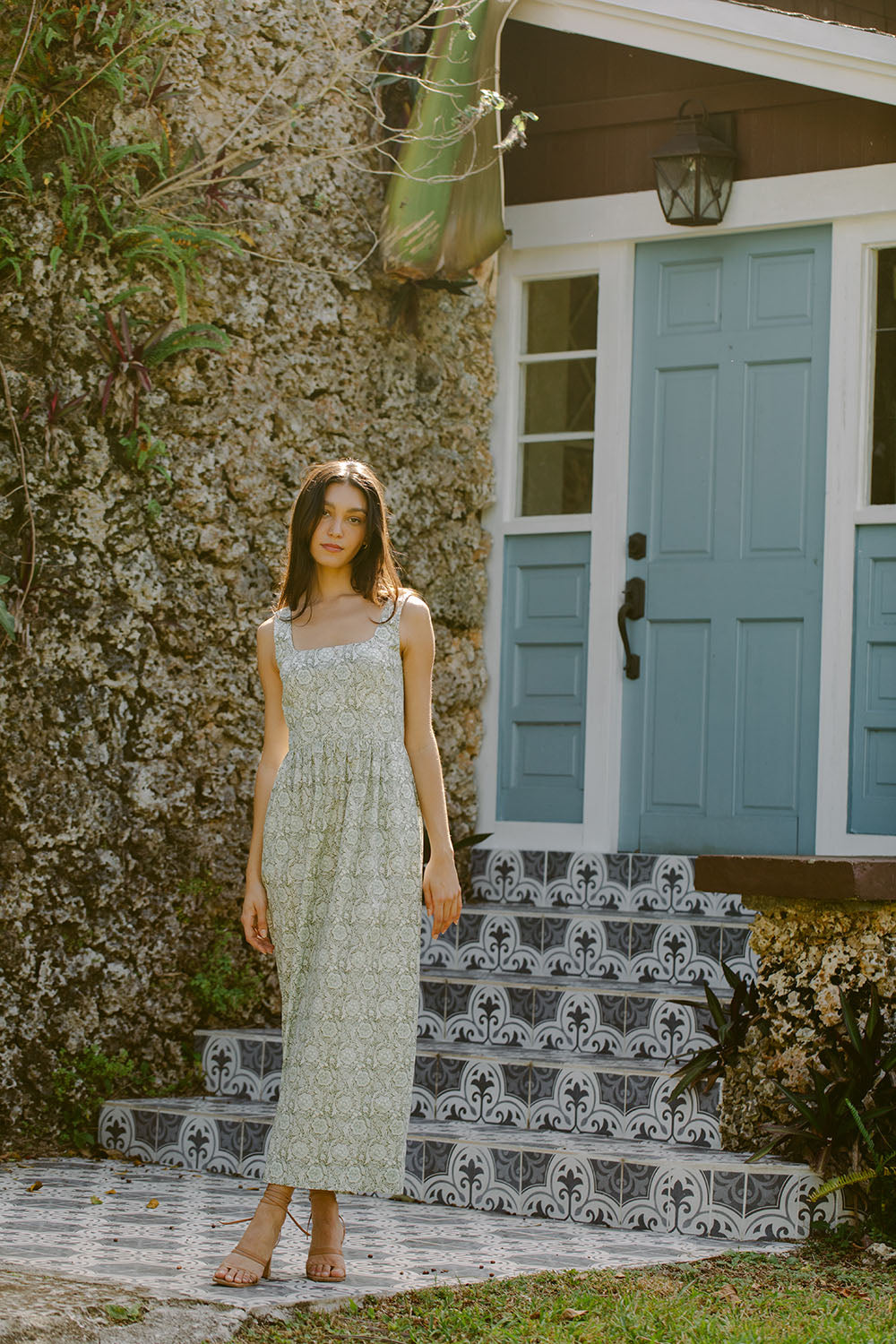 Woman in green floral dress