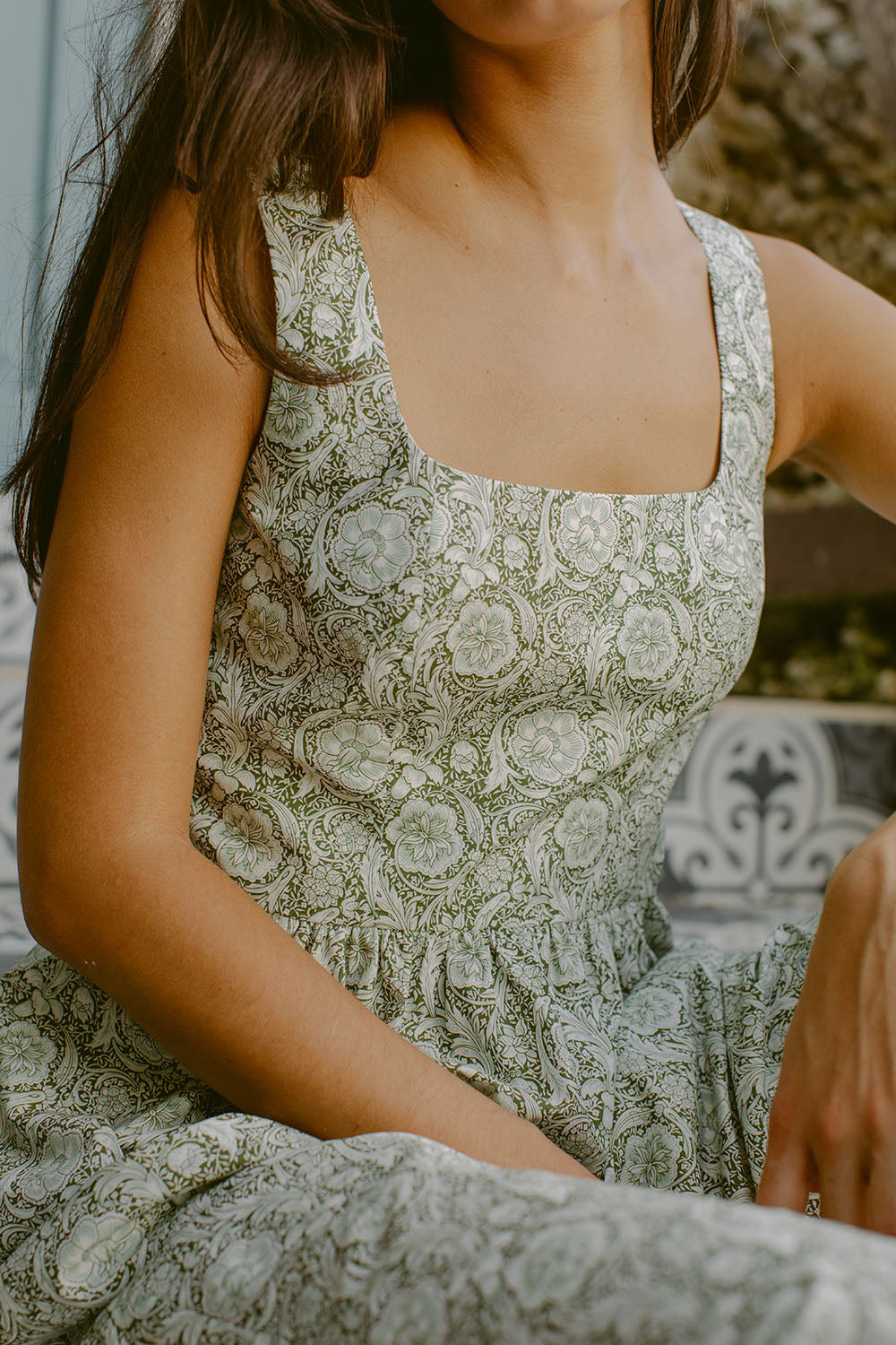 Woman in green floral dress